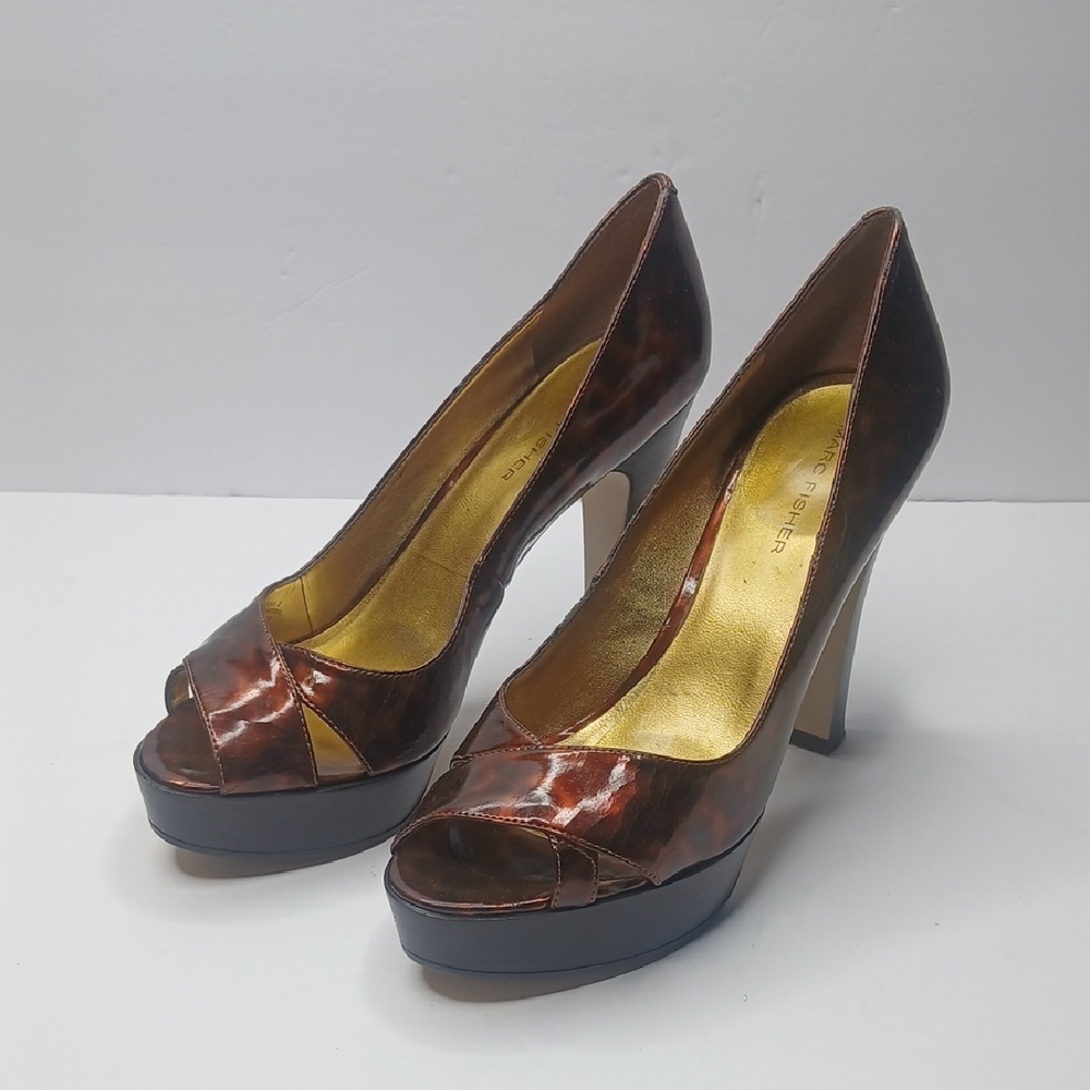 Marc Fisher platform heels in a brown‎ tortoise print with a peep-toe